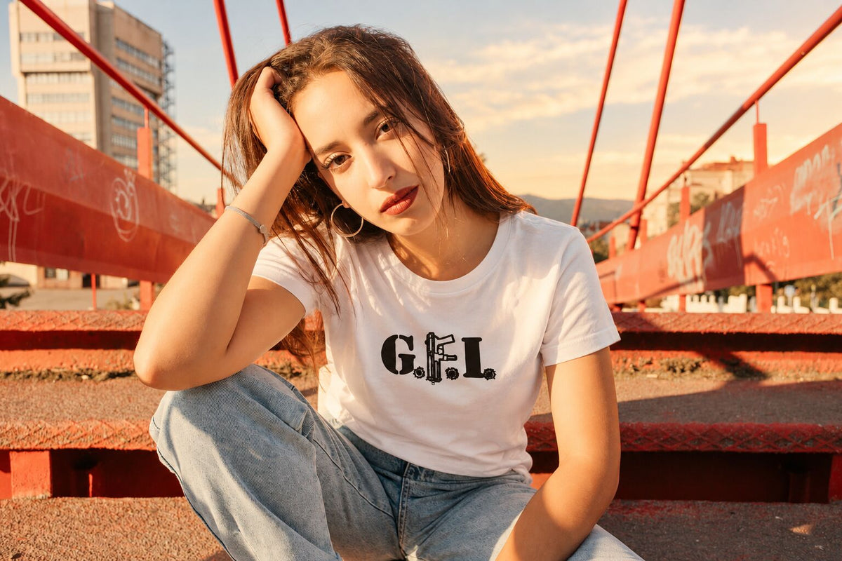 Club member sitting on red bridge steps in a white G.F.I. tee