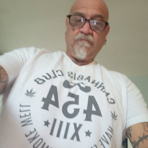 Club member in a white Cannabis Club 454 seal tee