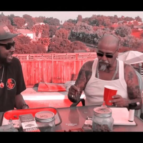 Two club members talking at an outdoor table on the show